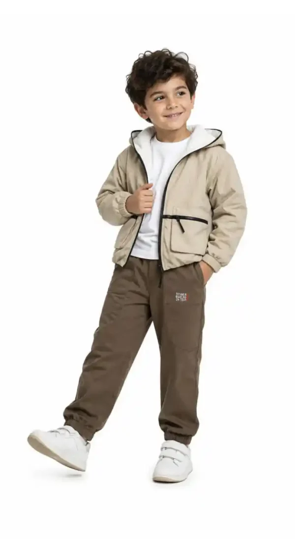 Boys' jacket with patterned fabric and front pockets.