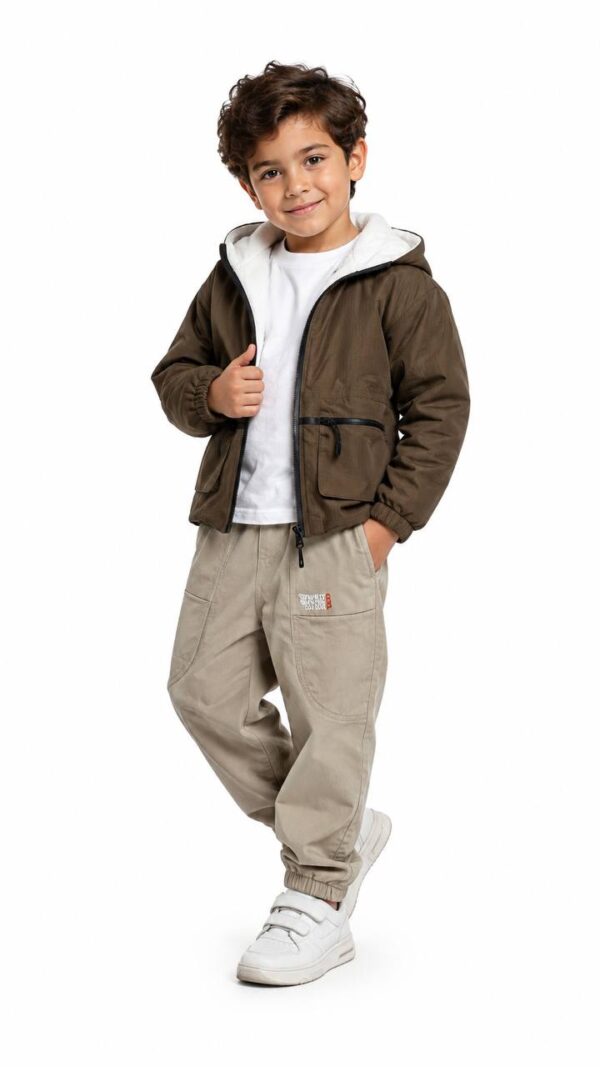 Boys' jacket with patterned fabric and front pockets.
